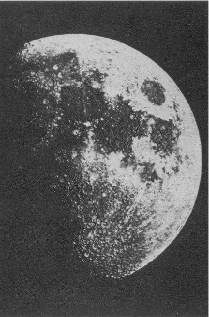 Black and white photo of the right side of the moon with black and white spots on its surface