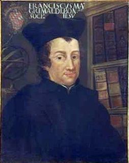 Painted portrait of a man wearing a hat and black robes posing in front of a bookcase