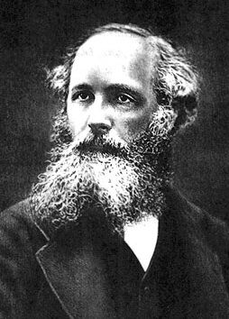 Portrait en noir et blanc d'un homme regardant vers sa droite et portant une longue barbe frisée.